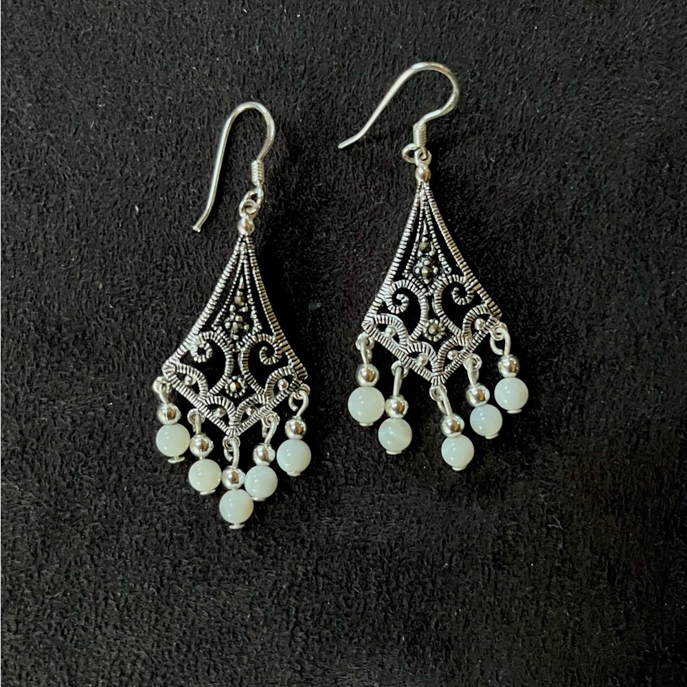 Silver tone and white bead dangle earrings
